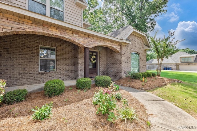 126 N Dogwood Ter, Wetumpka, AL 36093 - doorway to property with brick siding and a lawn