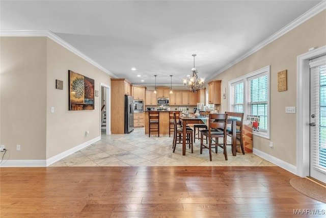 126 N Dogwood Ter, Wetumpka, AL 36093 - dining area with baseboards, a chandelier, light wood-style flooring, ornamental molding, and recessed lighting