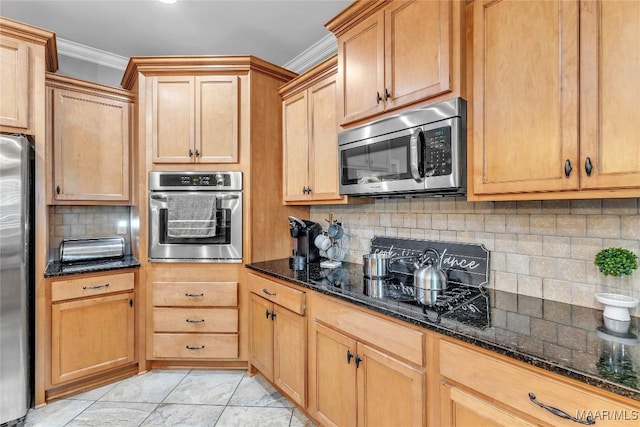 126 N Dogwood Ter, Wetumpka, AL 36093 - kitchen with stainless steel appliances, crown molding, dark stone counters, and decorative backsplash