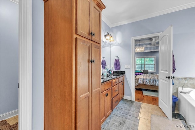 126 N Dogwood Ter, Wetumpka, AL 36093 - bathroom featuring crown molding, ensuite bathroom, a bath, tile patterned flooring, and vanity