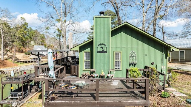 197 Maple Ridge Rd, Alexander City, AL 35010 - back of property featuring a chimney and a deck