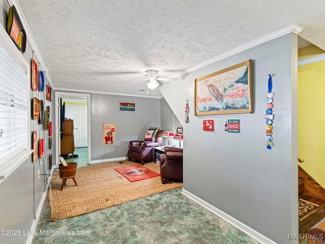 197 Maple Ridge Rd, Alexander City, AL 35010 - interior space featuring a textured ceiling, a ceiling fan, carpet, and crown molding
