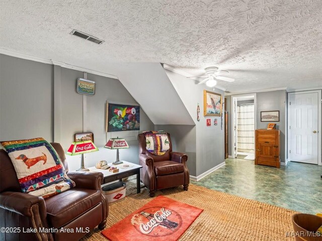 197 Maple Ridge Rd, Alexander City, AL 35010 - living room featuring baseboards, visible vents, ceiling fan, and a textured ceiling