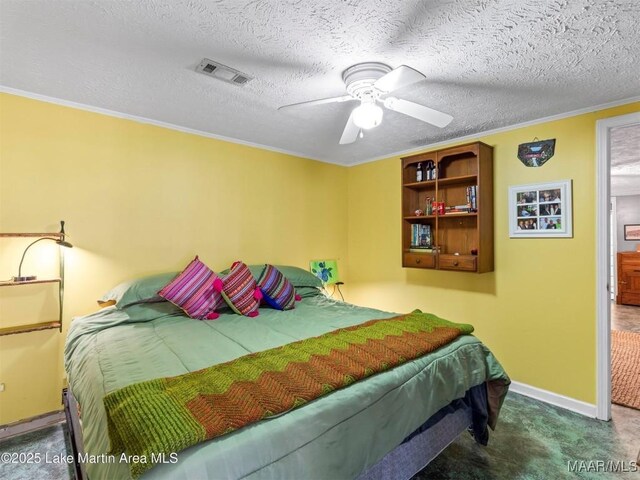 197 Maple Ridge Rd, Alexander City, AL 35010 - carpeted bedroom with baseboards, a textured ceiling, visible vents, and crown molding