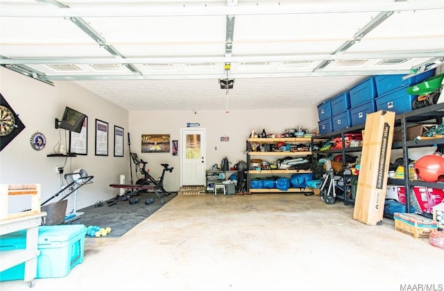 garage featuring a garage door opener