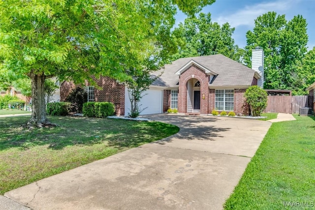 view of front of property featuring brick siding, concrete driveway, a garage, a chimney, and central AC