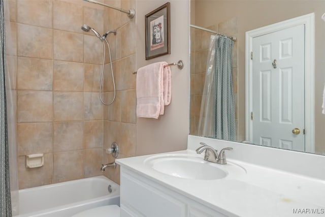 bathroom featuring toilet, shower / tub combo with curtain, and vanity