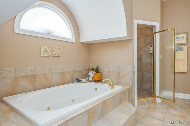 8681 Huntingdon Ridge Ln, Montgomery, AL 36117 - bathroom featuring a stall shower, a whirlpool tub, and tile patterned floors