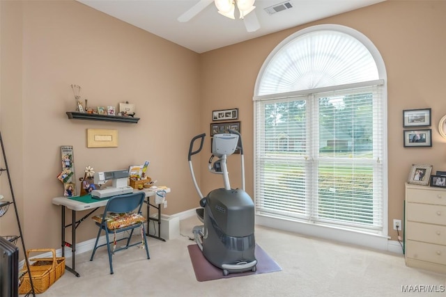 carpeted home office featuring visible vents, ceiling fan, and baseboards