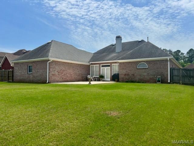 8681 Huntingdon Ridge Ln, Montgomery, AL 36117 - rear view of property with brick siding, a chimney, a patio area, and a shingled roof