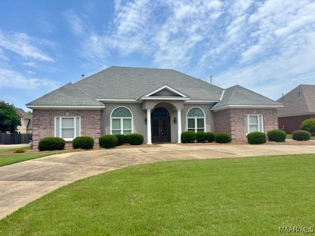 8681 Huntingdon Ridge Ln, Montgomery, AL 36117 - single story home featuring a front yard, french doors, and brick siding