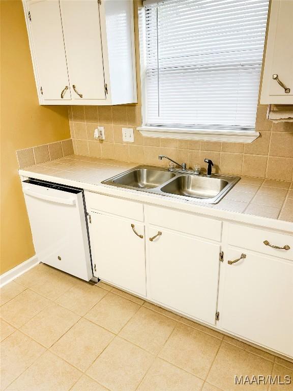 417 York Dr, Selma, AL 36701 - kitchen featuring dishwasher, a sink, white cabinetry, and light countertops