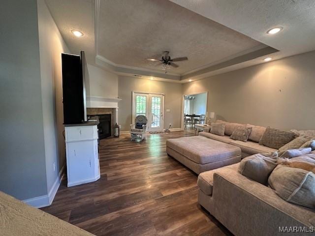 1518 White Cloud Dr, Deatsville, AL 36022 - living area with a tray ceiling, baseboards, a ceiling fan, and dark wood finished floors