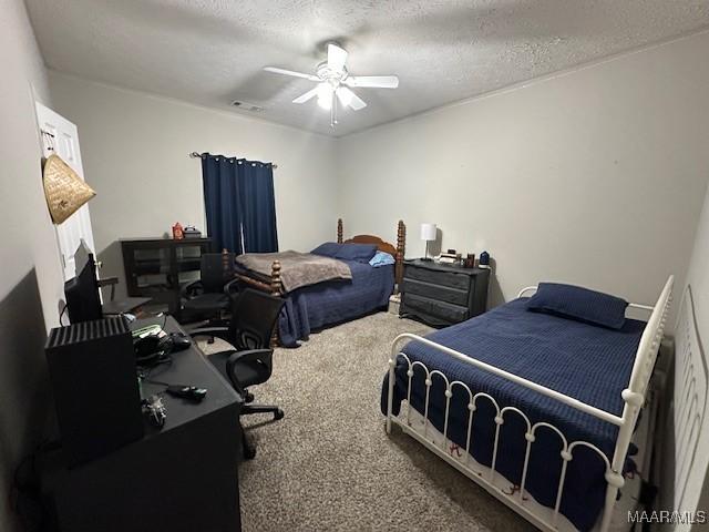 1518 White Cloud Dr, Deatsville, AL 36022 - bedroom with a textured ceiling, a ceiling fan, visible vents, and carpet floors
