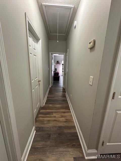 1518 White Cloud Dr, Deatsville, AL 36022 - corridor with dark wood-style flooring, baseboards, and attic access