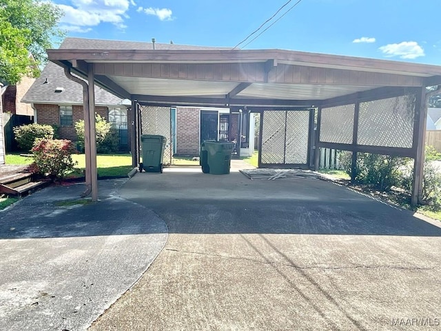 view of car parking featuring a carport and driveway