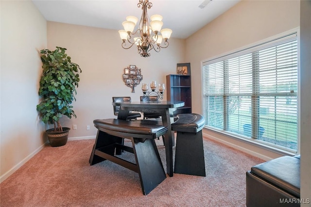 office space with carpet, baseboards, and an inviting chandelier