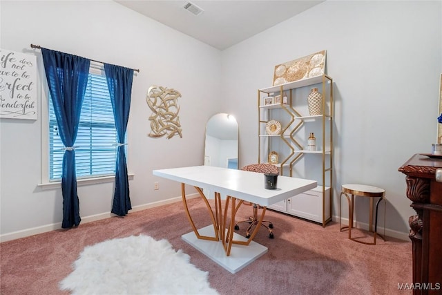 carpeted office with arched walkways, baseboards, and visible vents
