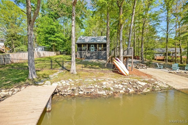 315 Lake Point Dr, Jacksons Gap, AL 36861 - rear view of property with a yard, fence, and a water view