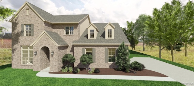 view of front of property featuring brick siding and a front lawn