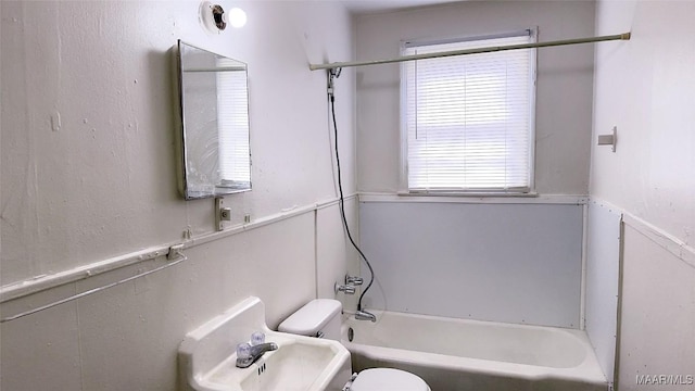 full bathroom with toilet and a wealth of natural light