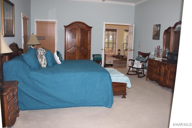 carpeted bedroom with ornamental molding