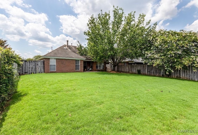 view of yard with a fenced backyard