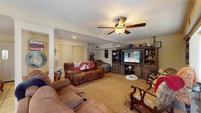 living room with crown molding and ceiling fan