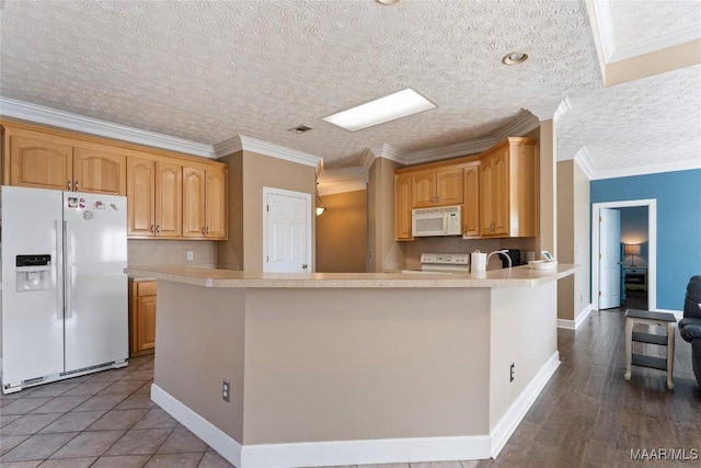 kitchen featuring white appliances, visible vents, light countertops, and baseboards