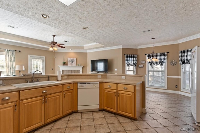 kitchen with visible vents, a sink, ornamental molding, white appliances, and light tile patterned flooring