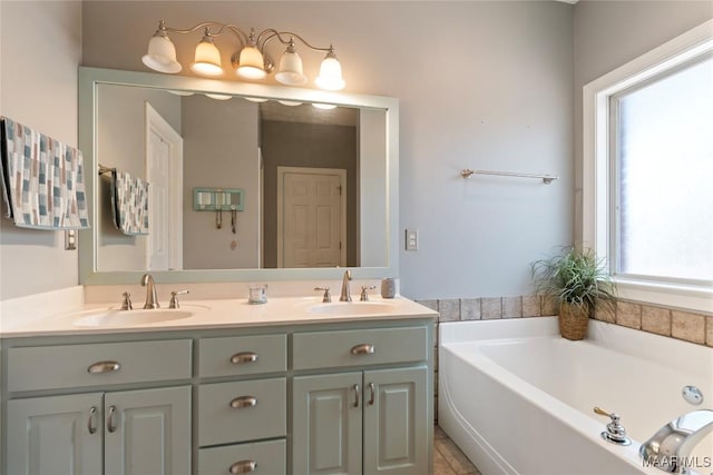 full bath with a garden tub, double vanity, and a sink