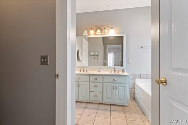 full bathroom featuring a bath, double vanity, a sink, and tile patterned flooring