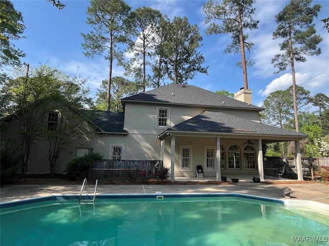 view of pool with a fenced in pool, a patio area, and fence