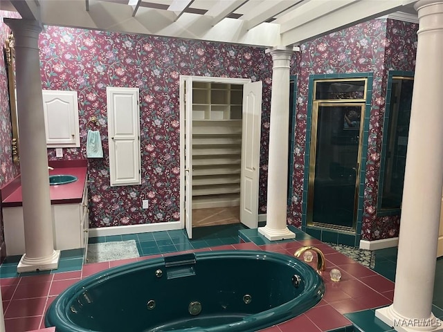 full bath featuring a shower stall, tile patterned floors, wallpapered walls, a jetted tub, and decorative columns