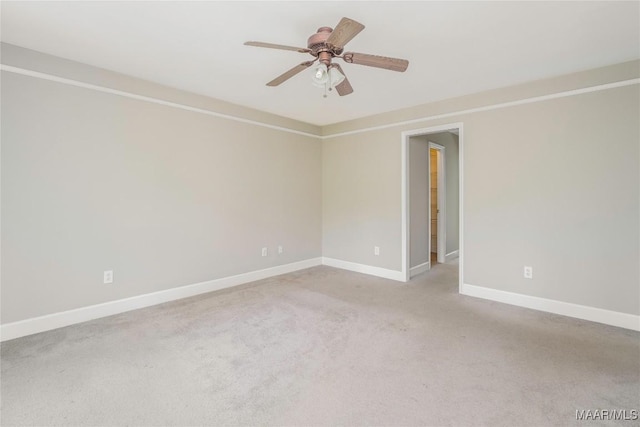 unfurnished room with baseboards, carpet flooring, and ceiling fan