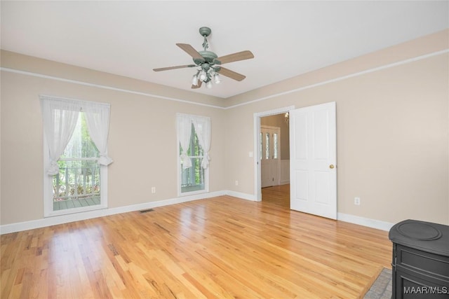 spare room with visible vents, a wealth of natural light, and light wood-style floors