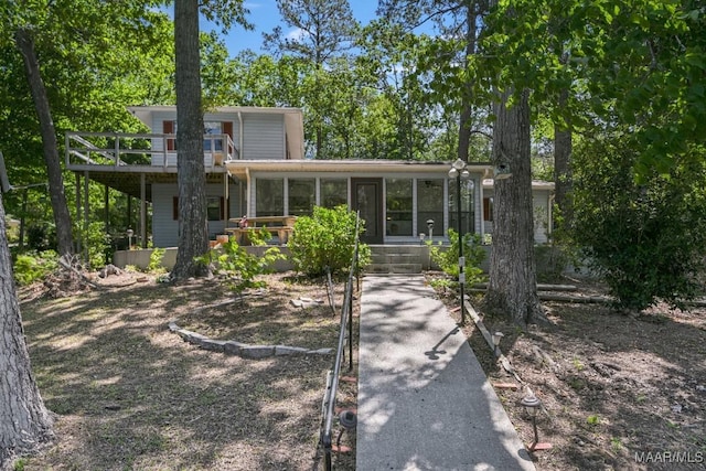 210 Weluvit Ln, Titus, AL 36080 - view of front facade featuring a sunroom and a wooden deck