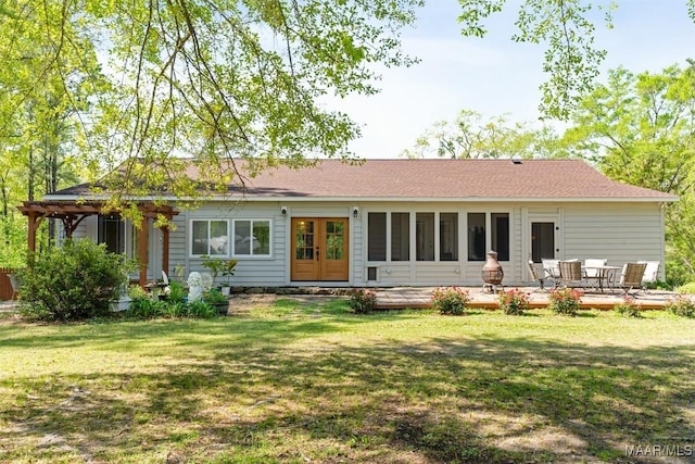 back of house with a yard, a deck, and french doors