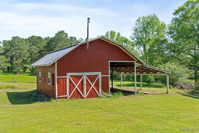 view of barn with a lawn