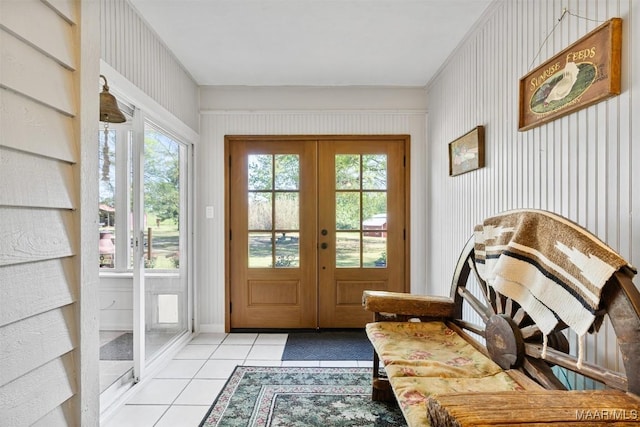 doorway to outside featuring french doors, light tile patterned floors, and a wealth of natural light