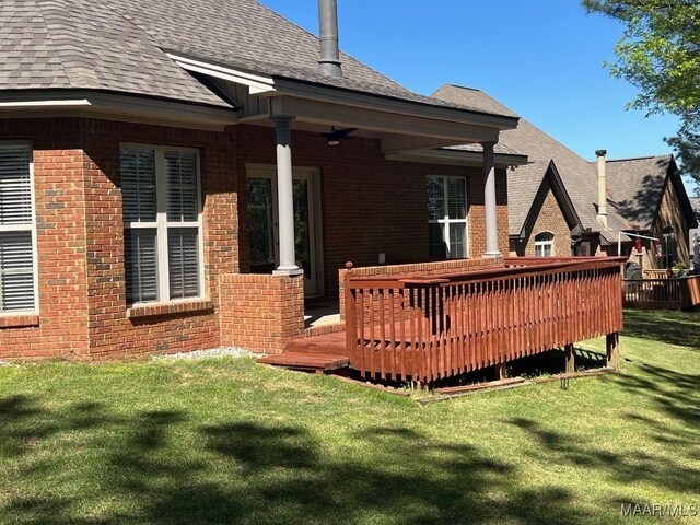79 Forest Hill Ct, Wetumpka, AL 36093 - back of house featuring brick siding, a shingled roof, a yard, a wooden deck, and a ceiling fan
