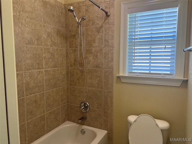 bathroom featuring toilet and shower / bathtub combination