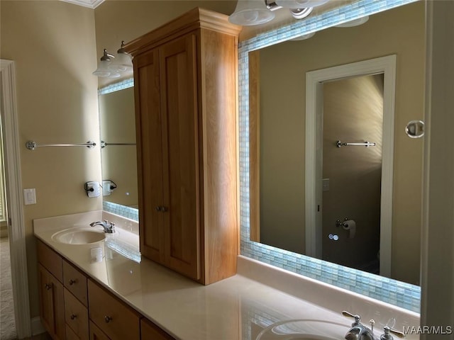 bathroom with a sink and double vanity