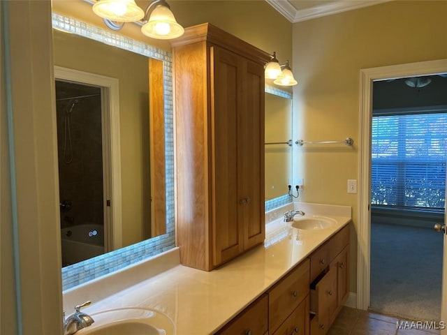 bathroom with double vanity, a sink, ornamental molding, and tile patterned flooring