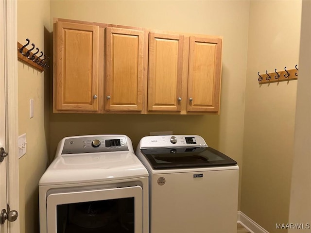laundry area with cabinet space and washing machine and dryer