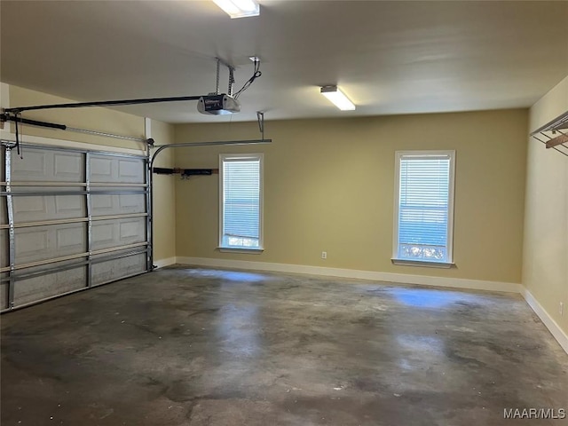 garage featuring baseboards and a garage door opener