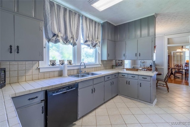 kitchen with light tile patterned floors, tasteful backsplash, ornamental molding, black appliances, and a sink