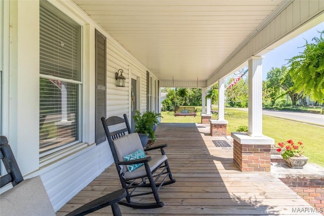 wooden deck featuring covered porch