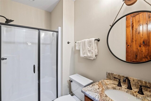 177 Tankersley Rd, Wetumpka, AL 36092 - full bathroom featuring toilet, a shower stall, and vanity