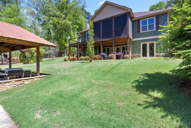 177 Tankersley Rd, Wetumpka, AL 36092 - rear view of property with french doors and a lawn